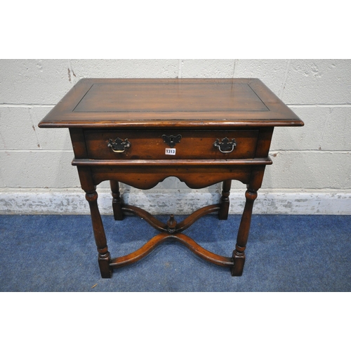 1313 - THEODORE ALEXANDER, A REPRODUCTION MAHOGANY SIDE TABLE / LOWBOY, with a single drawer, wavy apron, t... 