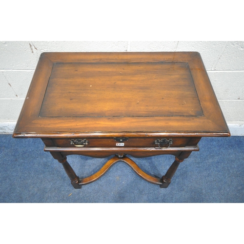 1313 - THEODORE ALEXANDER, A REPRODUCTION MAHOGANY SIDE TABLE / LOWBOY, with a single drawer, wavy apron, t... 