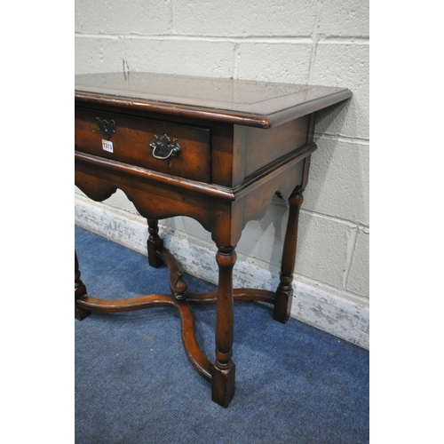 1313 - THEODORE ALEXANDER, A REPRODUCTION MAHOGANY SIDE TABLE / LOWBOY, with a single drawer, wavy apron, t... 