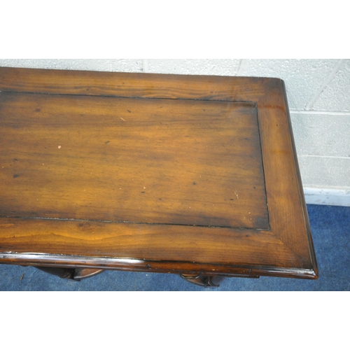 1313 - THEODORE ALEXANDER, A REPRODUCTION MAHOGANY SIDE TABLE / LOWBOY, with a single drawer, wavy apron, t... 