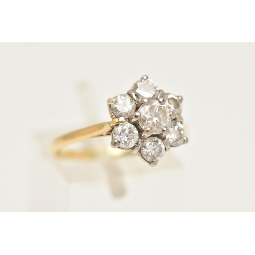 15 - AN 18CT GOLD DIAMOND DAISY CLUSTER RING, set with round brilliant cut diamonds, the central round br... 