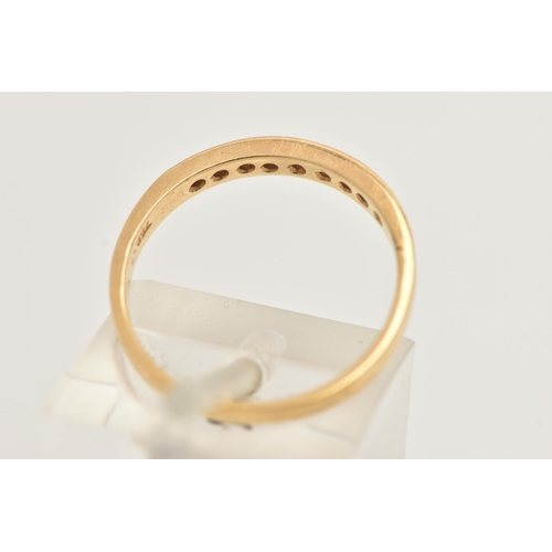 31 - A YELLOW METAL DIAMOND SET HALF ETERNITY RING, set with a row of nine small round brilliant cut diam... 