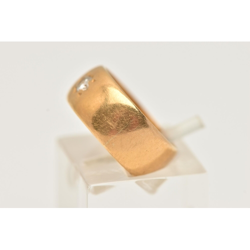 38 - A 22CT GOLD DIAMOND SET WIDE BAND RING, star set with a round brilliant cut diamond, estimated diamo... 