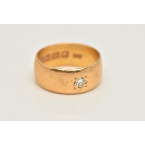 38 - A 22CT GOLD DIAMOND SET WIDE BAND RING, star set with a round brilliant cut diamond, estimated diamo... 