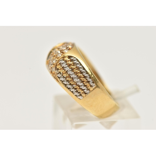 45 - A YELLOW METAL DIAMOND RING, pave set with a row of single cut diamonds, flanked with bi-colour wire... 