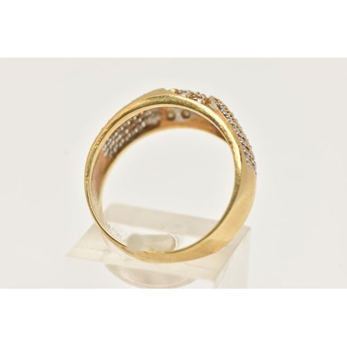 45 - A YELLOW METAL DIAMOND RING, pave set with a row of single cut diamonds, flanked with bi-colour wire... 