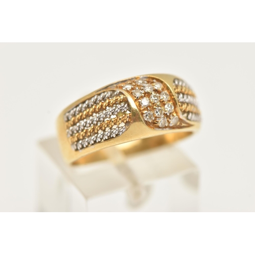 45 - A YELLOW METAL DIAMOND RING, pave set with a row of single cut diamonds, flanked with bi-colour wire... 