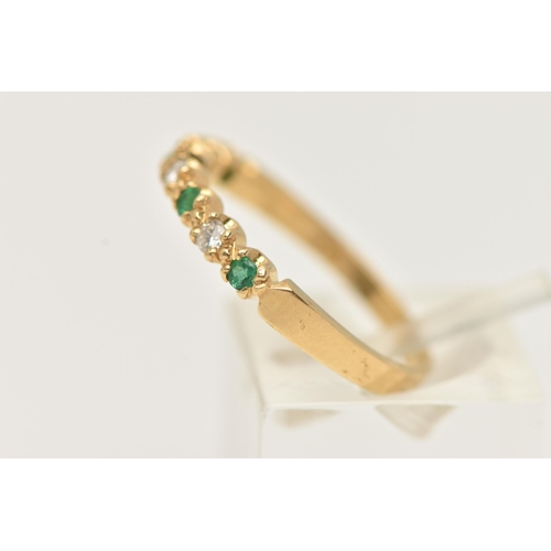 50 - AN 18CT GOLD EMERALD AND DIAMOND HALF ETERNITY RING, set with four small circular cut emeralds inter... 