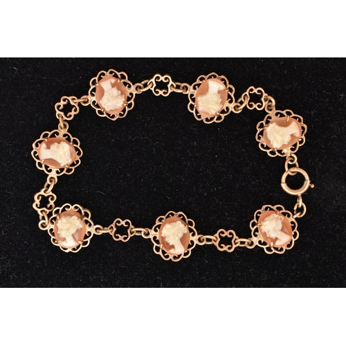 76 - A 9CT GOLD CAMEO BRACELET, designed as a series of seven oval carved shell cameos each depicting a l... 