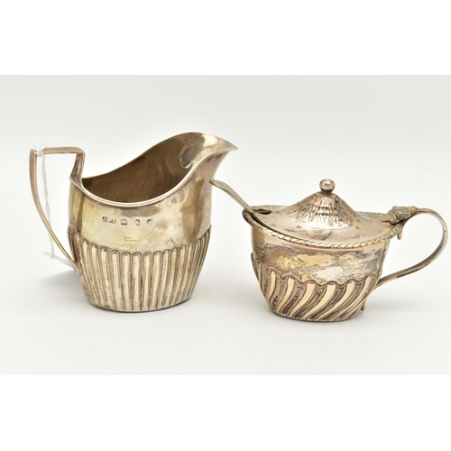 131 - TWO SILVER ITEMS, the first a small milk jug, rubbed Birmingham hallmark, the second a mustard, hall... 