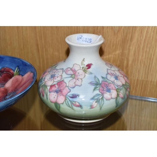 312 - TWO PIECES OF MOORCROFT POTTERY, comprising a 'Spring Blossom' squat form vase, decorated with pink ... 