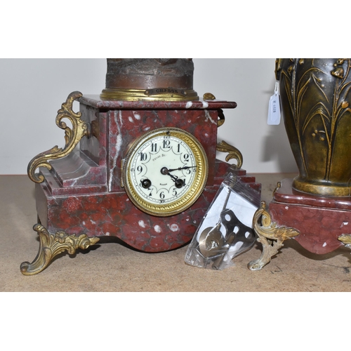 322 - A ROUGE MARBLE  MANTEL CLOCK,  a French clock surmounted by a spelter figure of a woman with a wild ... 