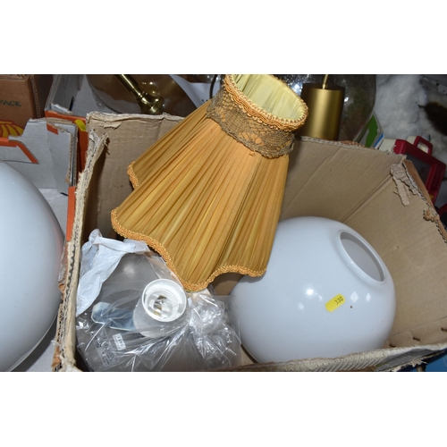 330 - FOUR BOXES AND LOOSE LAMPS AND SHADES to include three Ikea glass white spherical hanging lamps, app... 