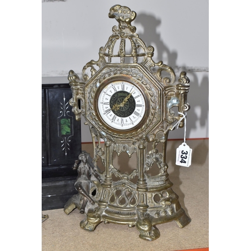 334 - A BLACK SLATE TIMEPIECE WITH A GOLD COLOURED CLOCK comprising a black slate mantel clock with three ... 