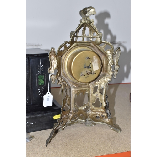 334 - A BLACK SLATE TIMEPIECE WITH A GOLD COLOURED CLOCK comprising a black slate mantel clock with three ... 