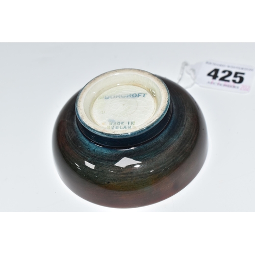 425 - A MOORCROFT POTTERY 'FREESIA' PATTERN FOOTED BOWL, diameter 8cm, a coral and yellow freesia on a mot... 