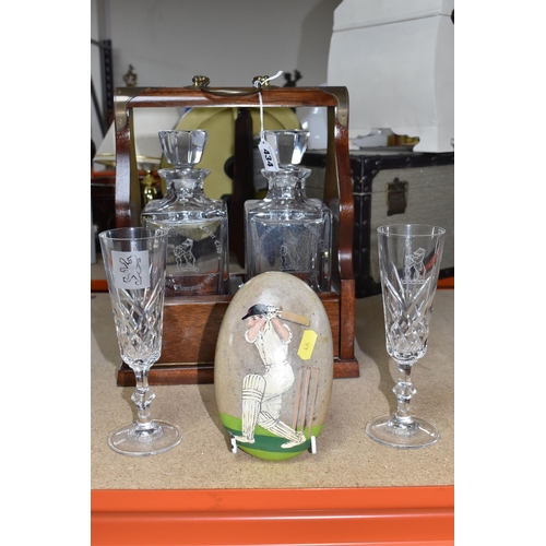 434 - A SMALL COLLECTION OF CRYSTAL ITEMS SPORTS RELATED, a dark wood with brass detail tantalus caddy wit... 
