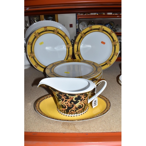 437 - VERSACE DINNER PLATES AND PLATED GRAVY BOAT, 'Barocco' design with yellow background rim black, yell... 