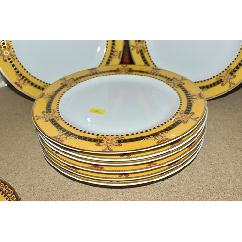 437 - VERSACE DINNER PLATES AND PLATED GRAVY BOAT, 'Barocco' design with yellow background rim black, yell... 