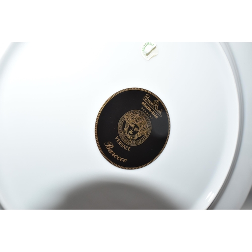 437 - VERSACE DINNER PLATES AND PLATED GRAVY BOAT, 'Barocco' design with yellow background rim black, yell... 