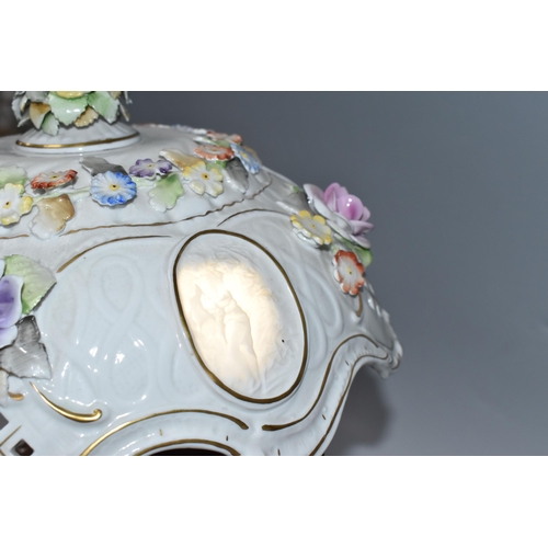 446 - AN EAST-GERMAN TWENTIETH CENTURY PORCELAIN FIGURAL LAMP with a pierced rococo style shade with litho... 