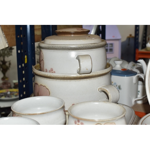 460 - A DENBY 'GYPSY' DINNER AND TEA SET comprising a butter dish, five egg cups, a salt and a pepper shak... 