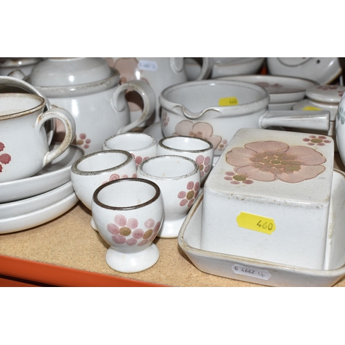 460 - A DENBY 'GYPSY' DINNER AND TEA SET comprising a butter dish, five egg cups, a salt and a pepper shak... 