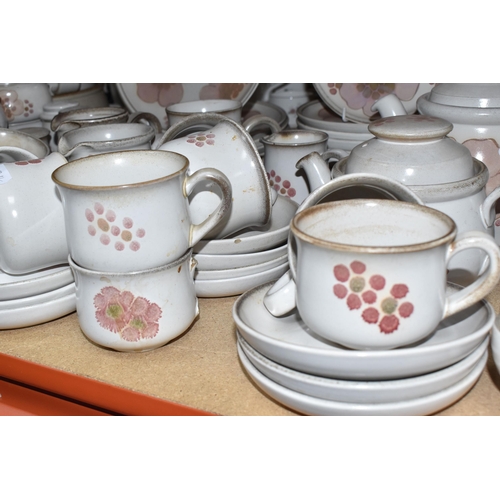 460 - A DENBY 'GYPSY' DINNER AND TEA SET comprising a butter dish, five egg cups, a salt and a pepper shak... 