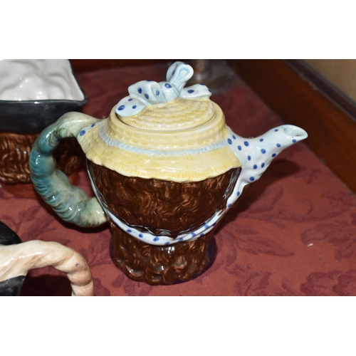 500 - A COLLECTION OF THREE BESWICK CHARACTER TEAPOTS, comprising two 'Dolly Varden' 1203 and one Peggotty... 