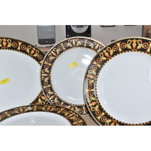 394 - A COLLECTION OF VERSACE DINNERWARE 'BAROCCO', a design of a black back ground rim, with shades of ye... 