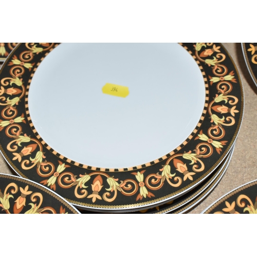 394 - A COLLECTION OF VERSACE DINNERWARE 'BAROCCO', a design of a black back ground rim, with shades of ye... 