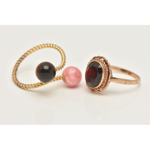 46 - TWO GEM SET RINGS, the first a 9ct rope twist ring set with a polished tiger eye ball terminal and r... 