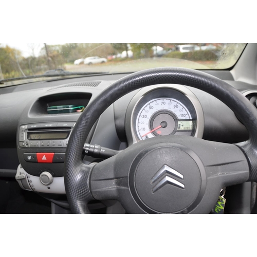 1002 - A 2006 CITROEN C1 THREE DOOR HATCHBACK CAR, in yellow with a 998cc petrol engine, 5 speed manual gea... 