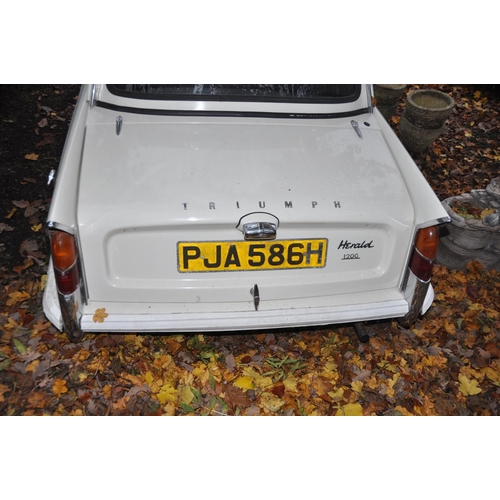 1013 - A 1970 TRIUMPH HERALD 1200 TWO DOOR SALOON CAR, in blue and white, with a 1147cc petrol engine, four... 