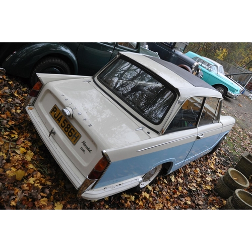 1013 - A 1970 TRIUMPH HERALD 1200 TWO DOOR SALOON CAR, in blue and white, with a 1147cc petrol engine, four... 