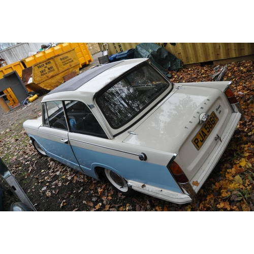 1013 - A 1970 TRIUMPH HERALD 1200 TWO DOOR SALOON CAR, in blue and white, with a 1147cc petrol engine, four... 