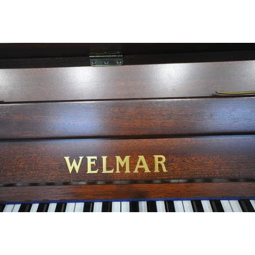 1201 - A WELMAR MAHOGANY UPRIGHT OVERSTRUNG PIANO, the hinged lid enclosing the gold painted cast iron fram... 