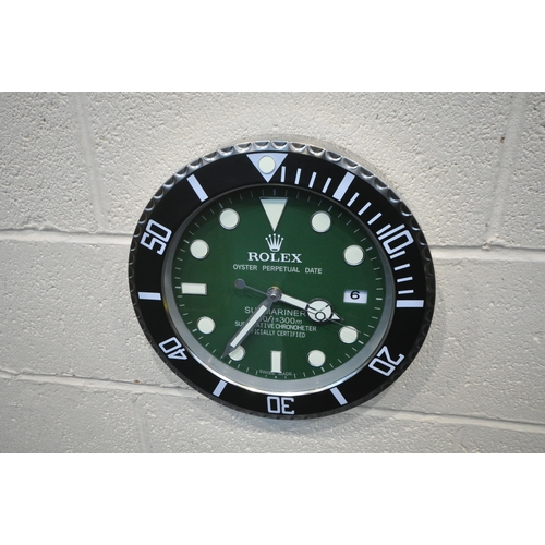 1202 - A ROLEX OYSTER PERPETUAL DATE SUBMARINER DEALERS ADVERTISING WALL CLOCK, with a green dial, diameter... 