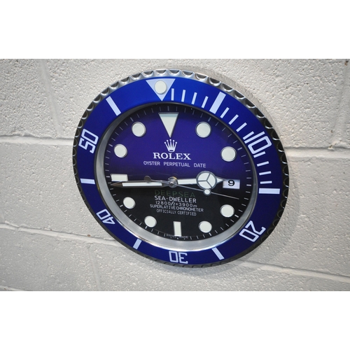 1203 - A ROLEX OYSTER PERPETUAL DATE DEEP SEA SEA-DWELLER DEALERS ADVERTISING WALL CLOCK, with a blue dial,... 