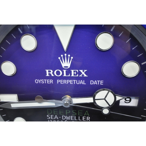 1203 - A ROLEX OYSTER PERPETUAL DATE DEEP SEA SEA-DWELLER DEALERS ADVERTISING WALL CLOCK, with a blue dial,... 