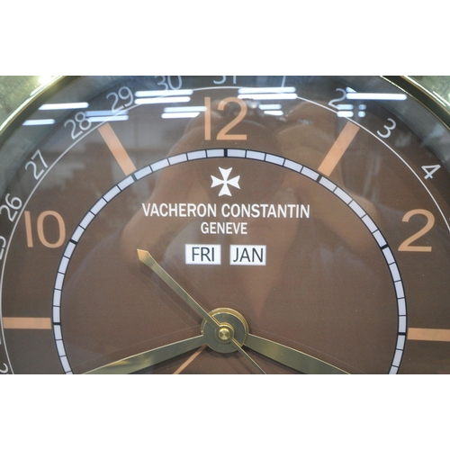 1205 - A VACHERON CONSTANTIN GENEVE DEALERS ADVERTISING WALL CLOCK, with a brown dial, diameter 40cm (condi... 