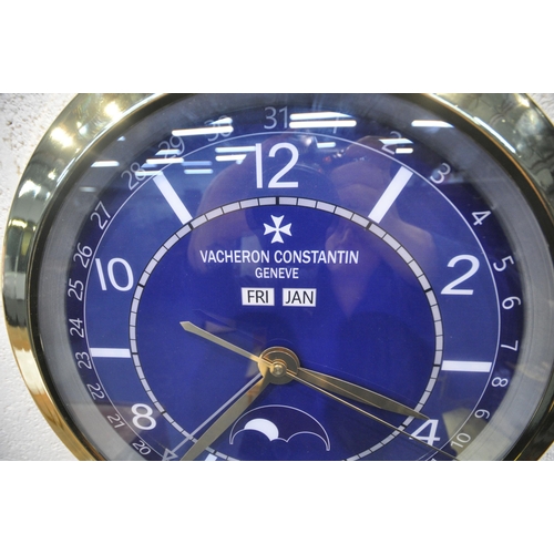 1206 - A VACHERON CONSTANTIN GENEVE DEALERS ADVERTISING WALL CLOCK, with a blue dial, diameter 40cm (condit... 