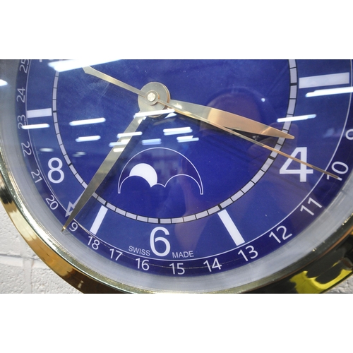 1206 - A VACHERON CONSTANTIN GENEVE DEALERS ADVERTISING WALL CLOCK, with a blue dial, diameter 40cm (condit... 