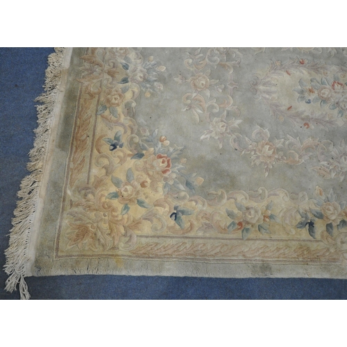 1214 - A LARGE RECTANGULAR CHINESE WOOLLEN RUG, 282cm x 180cm (condition report: has a few tassels missing ... 