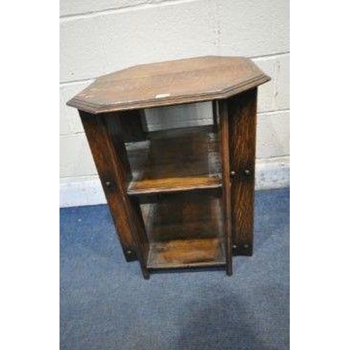 1228 - IN THE MANNER OF HEALS, AN ARTS CRAFTS THREE TIER OAK BOOK TABLE, with canted corners, 56cm squared ... 