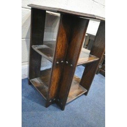 1228 - IN THE MANNER OF HEALS, AN ARTS CRAFTS THREE TIER OAK BOOK TABLE, with canted corners, 56cm squared ... 