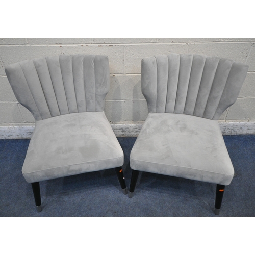 1231 - A PAIR OF LIGHT GREY PLUSH VELVET UPHOLSTERED CHAIRS, with shaped backrests, raised on cylindrical t... 