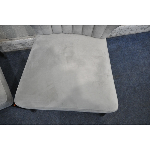 1231 - A PAIR OF LIGHT GREY PLUSH VELVET UPHOLSTERED CHAIRS, with shaped backrests, raised on cylindrical t... 