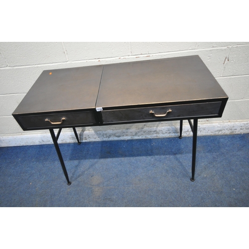 1238 - A METAL DRESSING TABLE, the hinged lid enclosing a mirror, beside a single drawer, raised on tubular... 