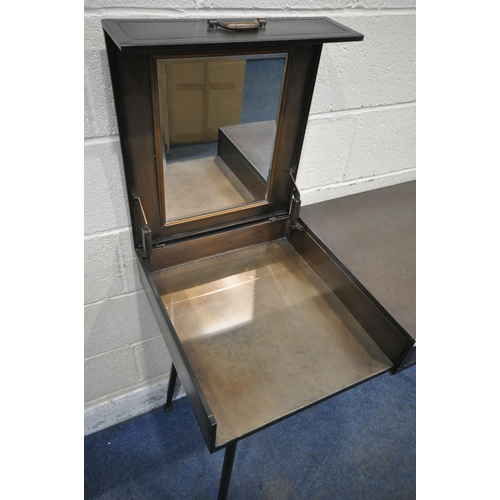 1238 - A METAL DRESSING TABLE, the hinged lid enclosing a mirror, beside a single drawer, raised on tubular... 